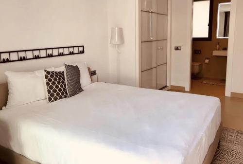 Кровать или кровати в номере Luxuriöses Apartment in Benidorm mit Pool