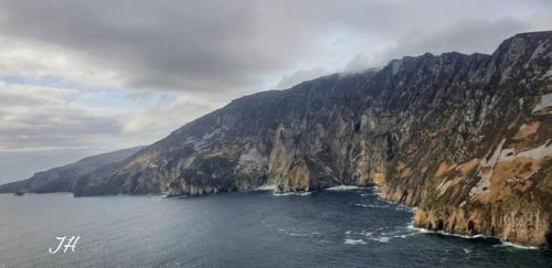 a view of a mountain with the ocean at Slieve League House B&B in Teelin
