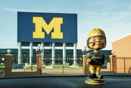 a toy figurine of a football player standing in front of a m building at Graduate by Hilton Ann Arbor in Ann Arbor