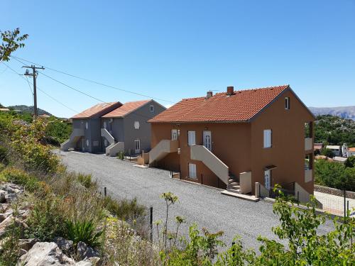a row of houses on a road at Slavica apartments 2 in Sveti Juraj