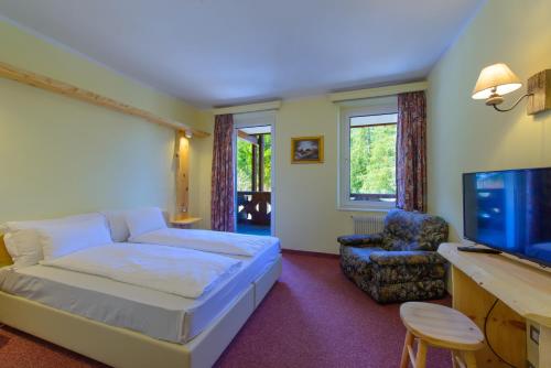 Park Hotel Faloria tesisinde bir odada yatak veya yataklar