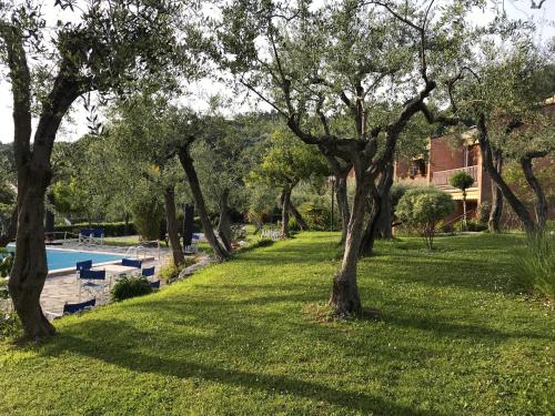 a park with trees and a swimming pool at La Casa fra gli ulivi in Lerici