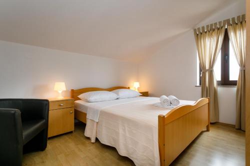 Posteľ alebo postele v izbe v ubytovaní Apartman Sintić