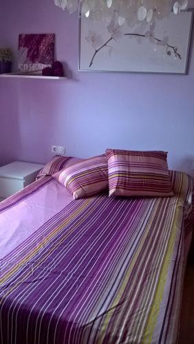 Ένα ή περισσότερα κρεβάτια σε δωμάτιο στο Primera línea, magníficas vistas al mar y a la playa