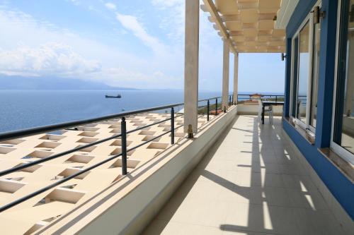 a balcony with a view of the ocean at Blue Residence in Sarandë
