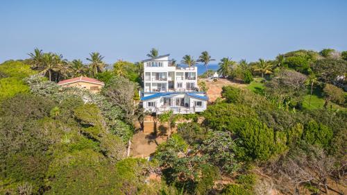 an aerial view of a house on a hill at Villa Topaz Above West Bay with 360 Degree Views! in West Bay