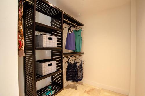 a walk in closet with black shelving at Villa Topaz Above West Bay with 360 Degree Views! in West Bay