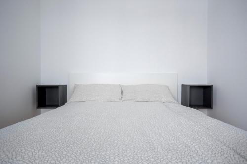 מיטה או מיטות בחדר ב-Auredius Deluxe Sea Apartment