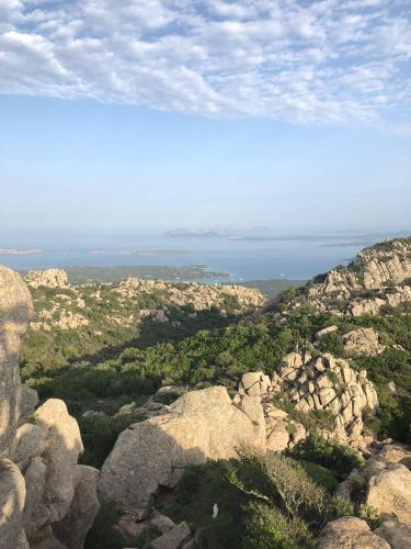 a view from the top of a mountain with rocks at Li Cimi in San Pantaleo