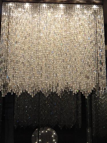 a large silver chandelier hanging from a ceiling at Hotel Orbit in Chandīgarh