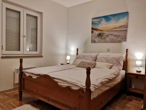 a bedroom with a bed and a window at Suite Vigo Medulin in Medulin