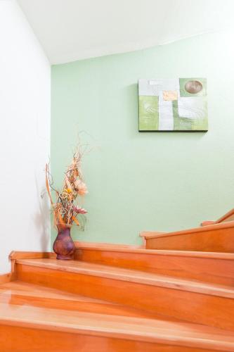 a vase sitting on the stairs of a church at Apartments Garmaz in Podgora