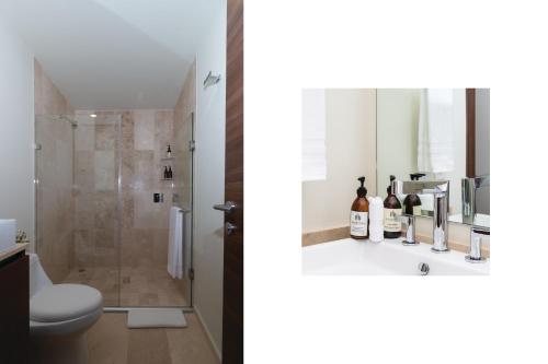 a bathroom with a toilet and a shower at Botticelli Tower By The Local Way in Mexico City