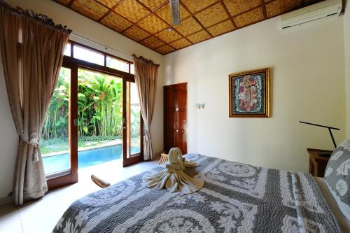 A bed or beds in a room at Villa Asri