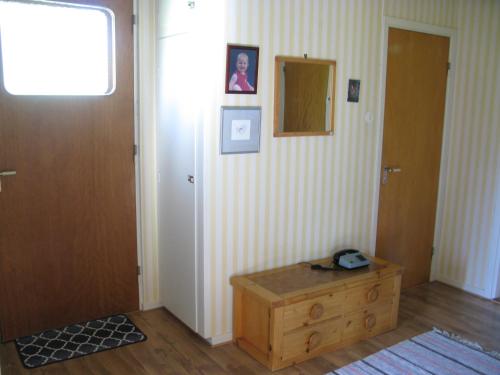 a room with a hallway with a door and a table at Stenslid Bottna By St Anna in Söderköping