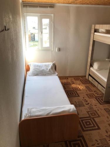 Un pat sau paturi într-o cameră la Comfort Guest House