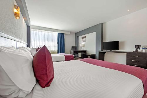 Postel nebo postele na pokoji v ubytování Comfort Inn Morelia