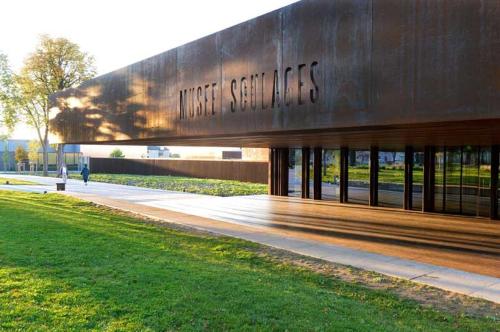 a building with the words first socializers written on it at Les Inseparables in Sévérac-lʼÉglise