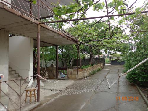 a building with a net on the side of it at My home udabno in Udabno
