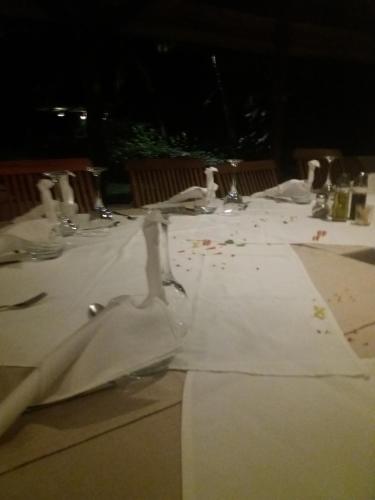 
a table that has a table cloth on it at Hotel Arc En Ciel in Dzamandzar
