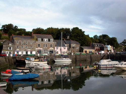 a group of boats are docked in a harbor at Samphire in Padstow