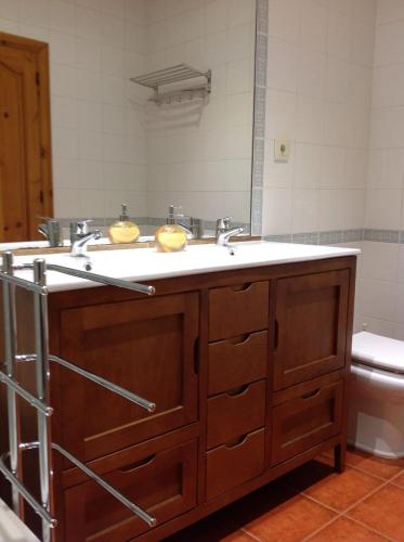 a bathroom with a sink and a toilet at El Mirador de Biedes in Infiesto