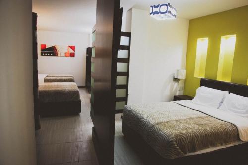 Säng eller sängar i ett rum på Hotel Rincon del Cielo