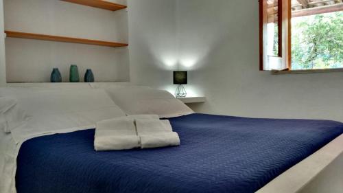 Casa Volcanalia tesisinde bir odada yatak veya yataklar