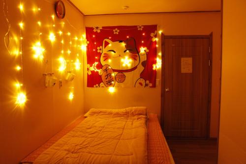 Ένα ή περισσότερα κρεβάτια σε δωμάτιο στο Baozen Guesthouse