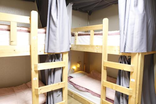 Ένα ή περισσότερα κρεβάτια σε δωμάτιο στο Baozen Guesthouse