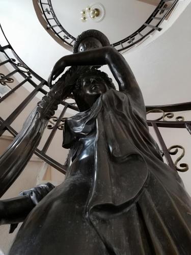 a statue of a woman with her hands on her head at Hotel My House in Kŭrdzhali