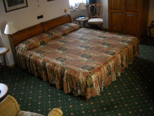 Postel nebo postele na pokoji v ubytování Hotel Faccioli