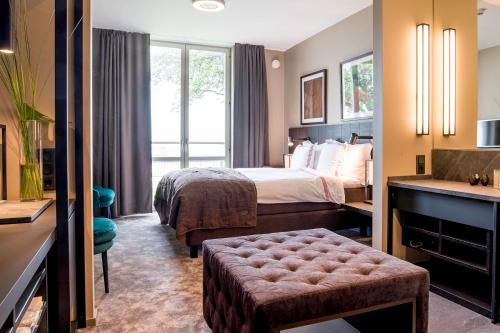 Säng eller sängar i ett rum på Hotel Skansen Båstad