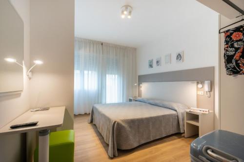 Postel nebo postele na pokoji v ubytování Hotel Fabris