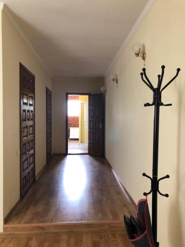 an empty room with a hallway with a cross on the wall at Guest house on Ivana Franka in Novyye Petrovtsy