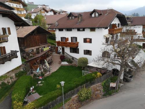 an aerial view of a house with a yard at Garni Reider in Meltina