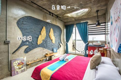 Postel nebo postele na pokoji v ubytování 墾丁 Sky Villa 工業風設計 包棟民宿