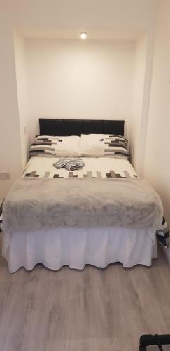 a bedroom with a large bed in a room at Rooftop Apartments in Belfast
