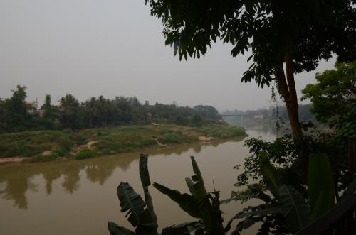 a river with trees on the side of it at Moonlight Champa Riverview in Luang Prabang