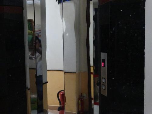 a room with several pairs of skis on a wall at Thuong Hai Hotel in Ho Chi Minh City