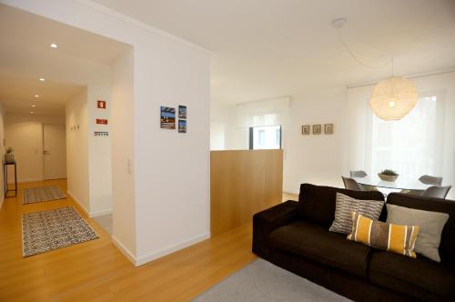 a living room with a couch and a table at Enjoy Lisbon Martim Moniz 1 in Lisbon