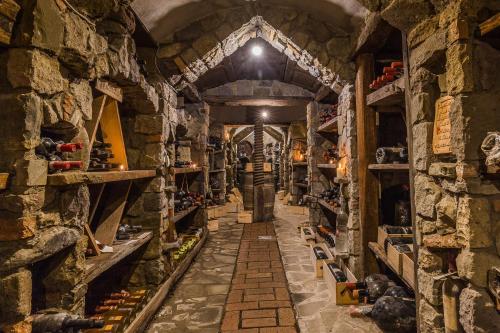 a long hallway in a stone building with shelves at Quattro Passi Relais in Nerano