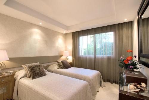 Ένα ή περισσότερα κρεβάτια σε δωμάτιο στο Apt 212 Heaven Beach Apartments, Guadalmansa Playa