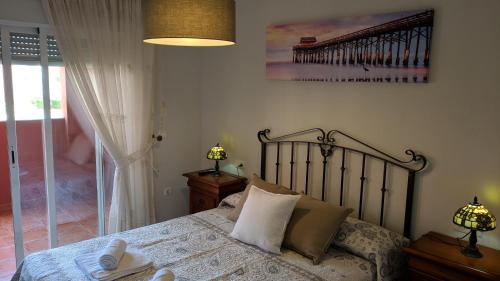 Cama o camas de una habitación en Apartamento las Camelias