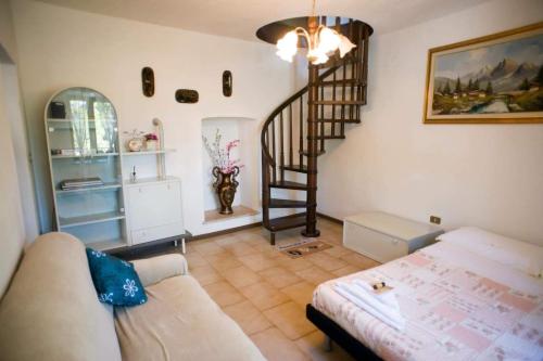 a living room with a staircase and a couch at Martin in Trento