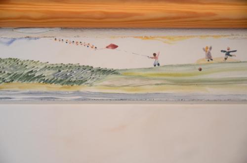 a painting of people flying a kite at Schloss Herberge Hohenerxleben in Hohenerxleben