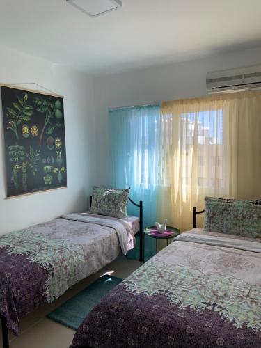 Postel nebo postele na pokoji v ubytování Tatli Apartment