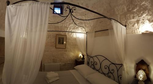 Posteľ alebo postele v izbe v ubytovaní TRULLI ASIA