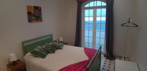 A bed or beds in a room at Ocean Front View