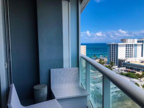 a balcony in a hotel with a view of the ocean at 1201 W Residences in Fort Lauderdale
